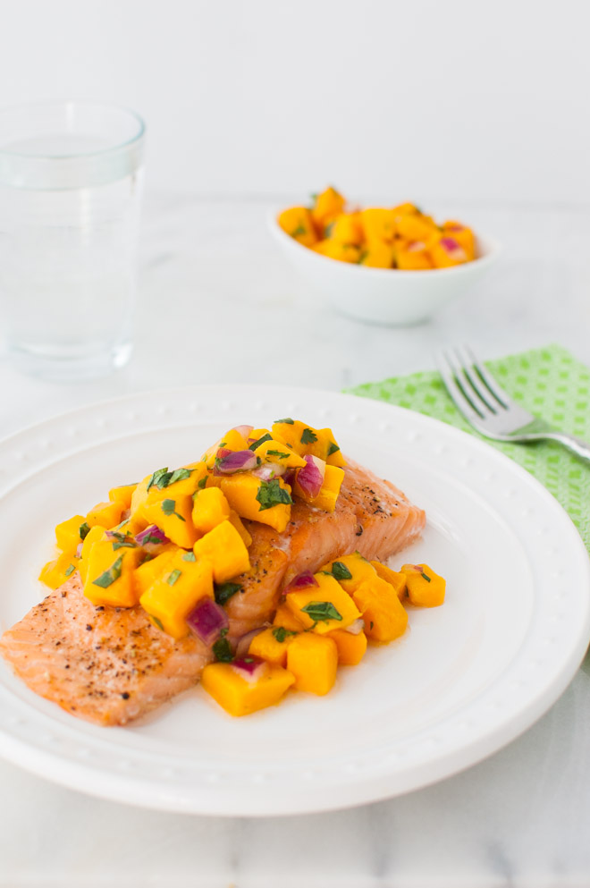 Roasted Salmon with Mango Salsa - Oven roasted salmon topped with a bright, sweet, and spicy mango salsa. | tamingofthespoon.com