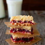 A stack of three cranberry orange crumb bars.