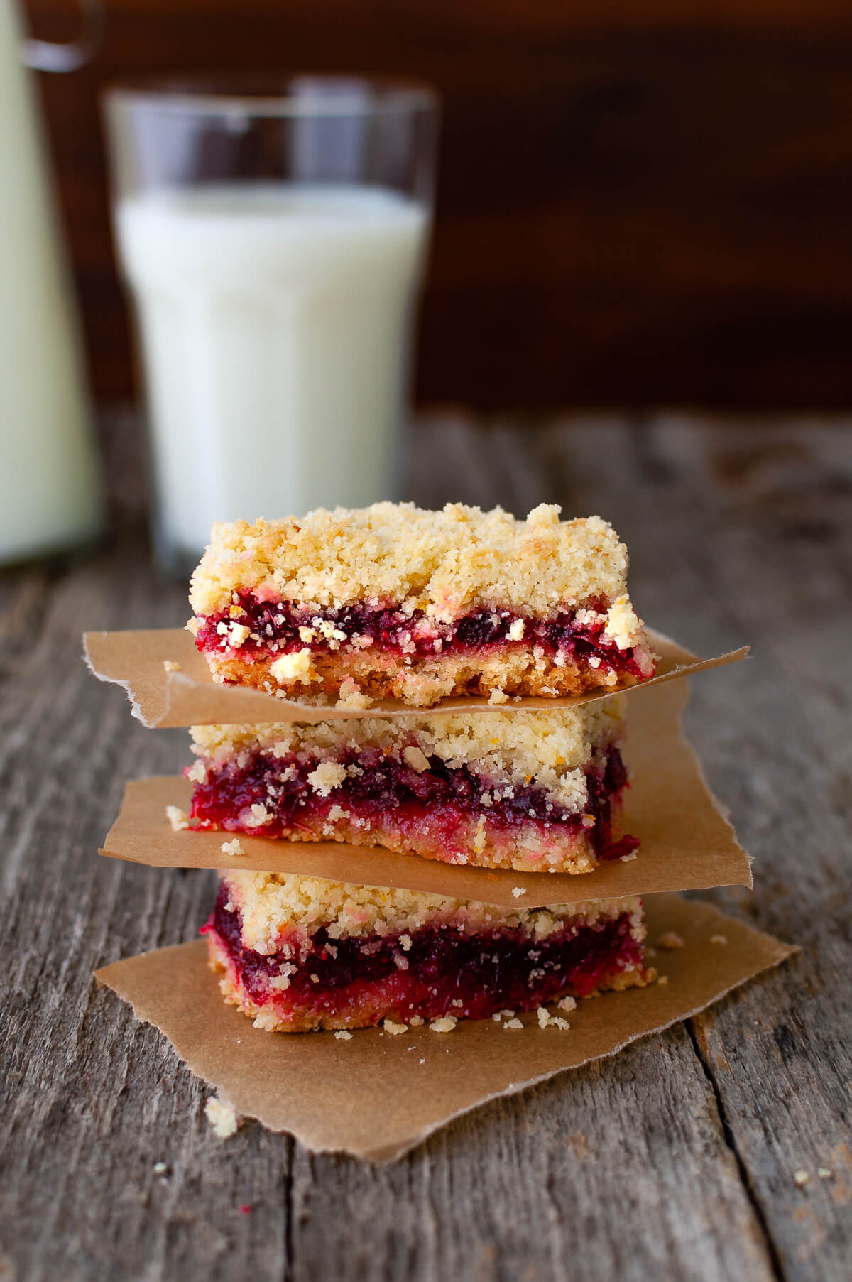 A stack of three cranberry orange crumb bars.