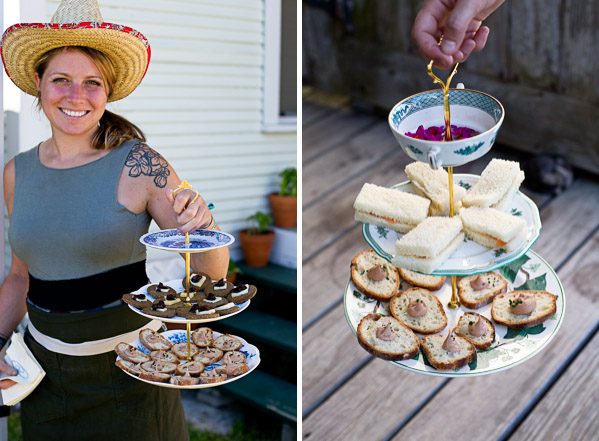 A server holding a platter of appetizers.