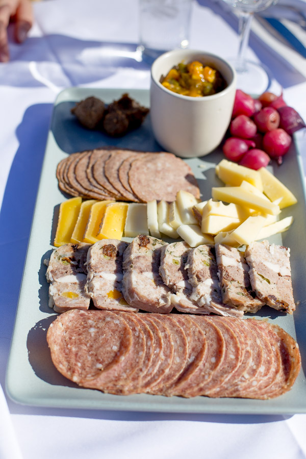 A platter of cheese and charcuterie.