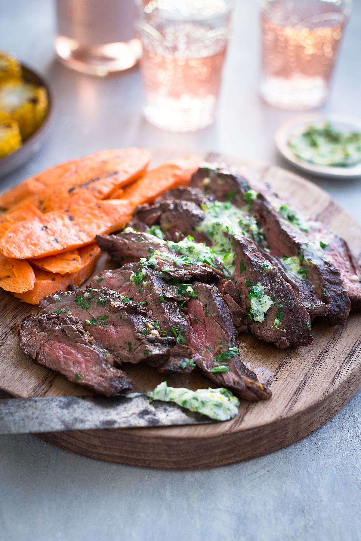 Slices of steak topped with compound butter.