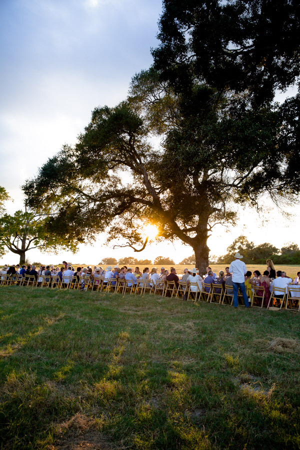 A long table outside at sunset.