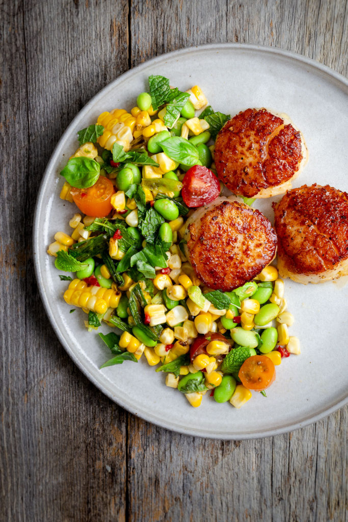 Seared Scallops with Corn Salad and Miso Dressing - Enjoy the best of summer produce with this corn salad topped with seared and butter basted scallops.