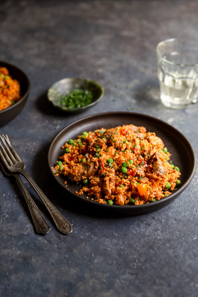 Chicken and Sausage Paella with Couscous - authentic paella flavors made quick and easy with couscous and boneless chicken thighs. Great for a weeknight dinner!
