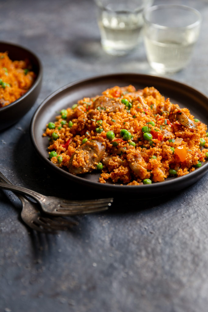 Chicken and Sausage Paella with Couscous - authentic paella flavors made quick and easy with couscous and boneless chicken thighs. Great for a weeknight dinner!