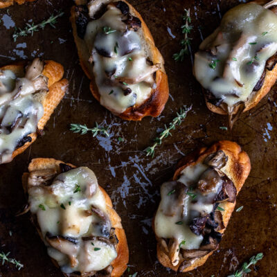 Mushroom Crostini on a metal tray.