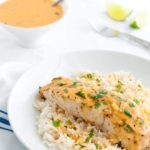 Plate of mahi-mahi with Thai coconut curry sauce and steamed rice.