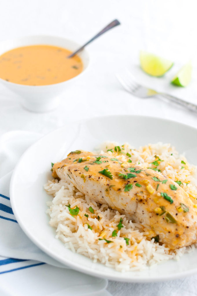 Plate of mahi-mahi with Thai coconut curry sauce and steamed rice.