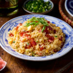 Fried rice on a blue and white plate.