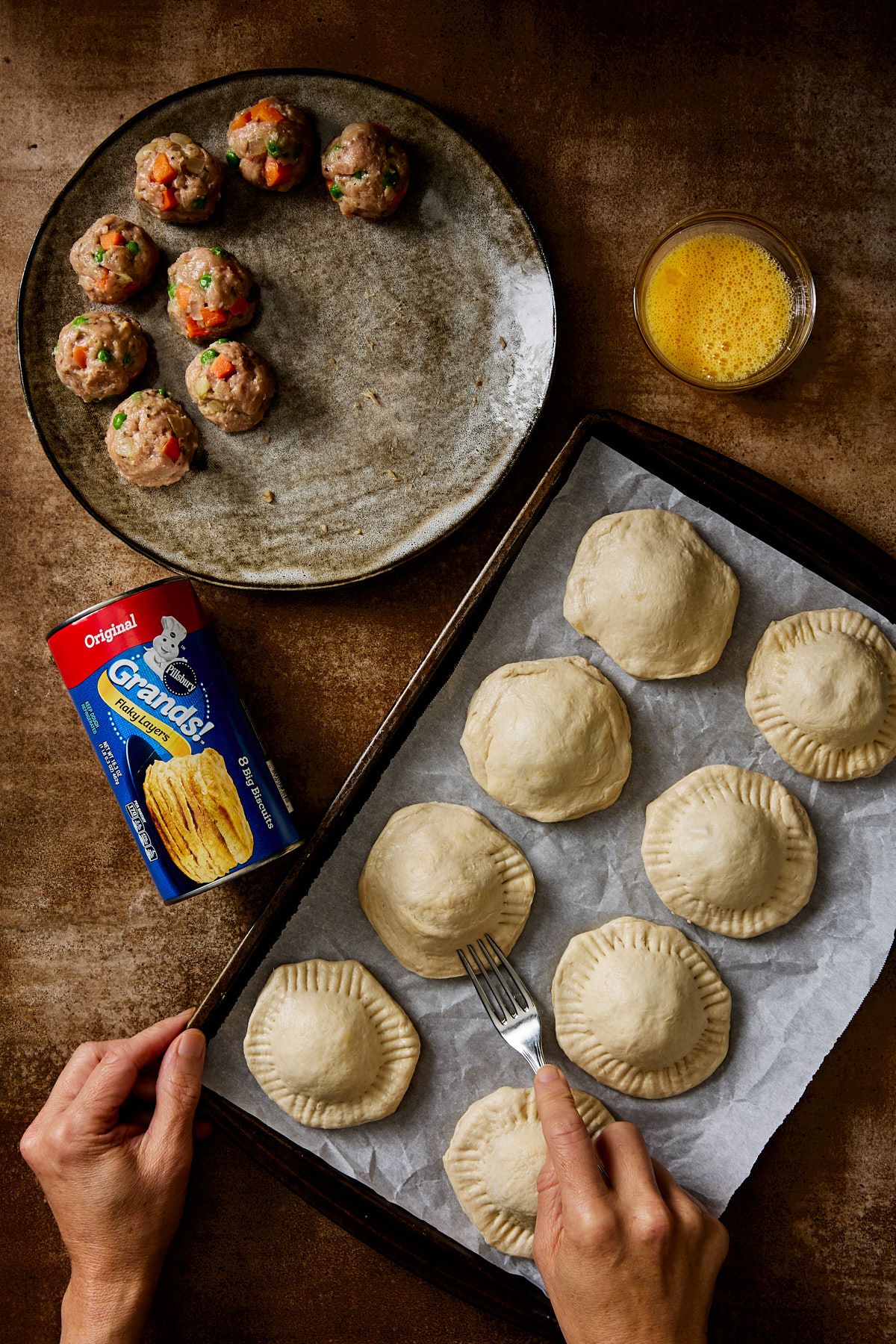 Crimping paté chaud with a fork.