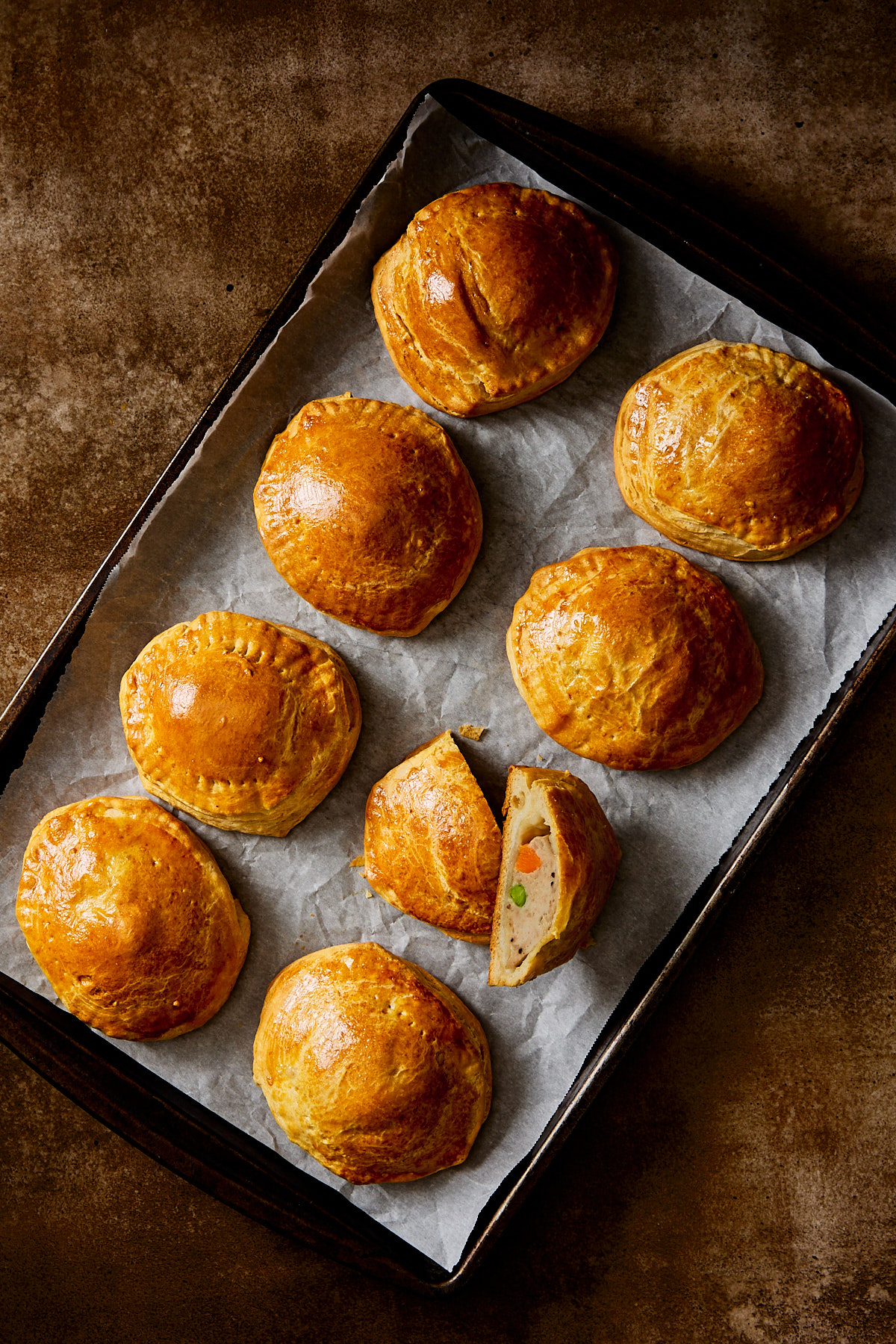 Baked paté chaud on a baking sheet.