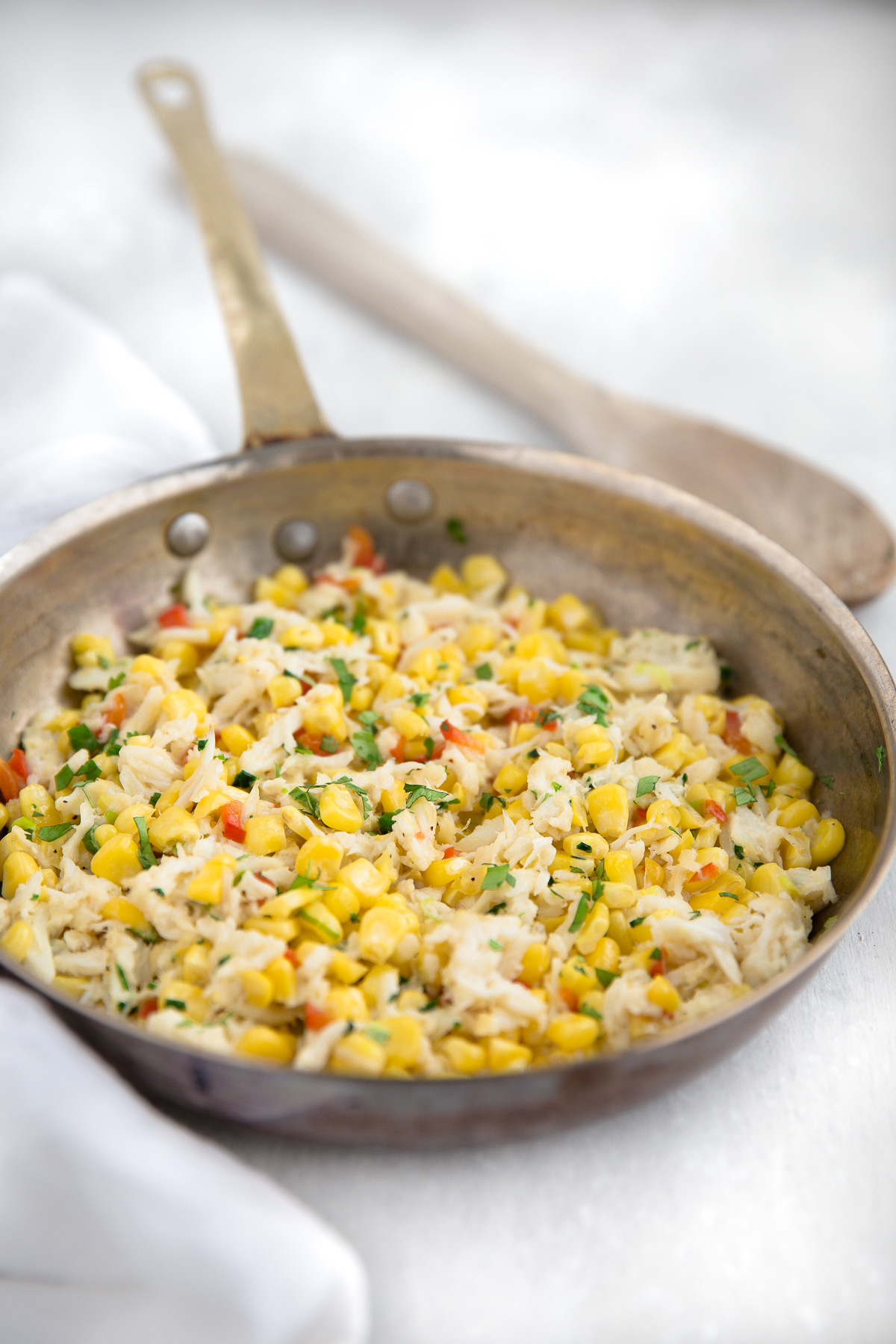 Filling for crab and corn ravioli in a sauté pan.