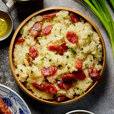 A plate of sticky rice with Chinese sausage.